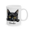 Personalized ceramic mug featuring a photorealistic black cat peeking over the rim, with the name Simba in black script lettering