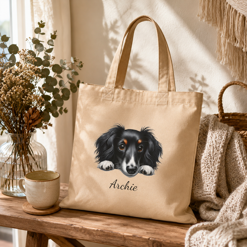 Close-up of the dog portrait illustration and personalized name on the tote