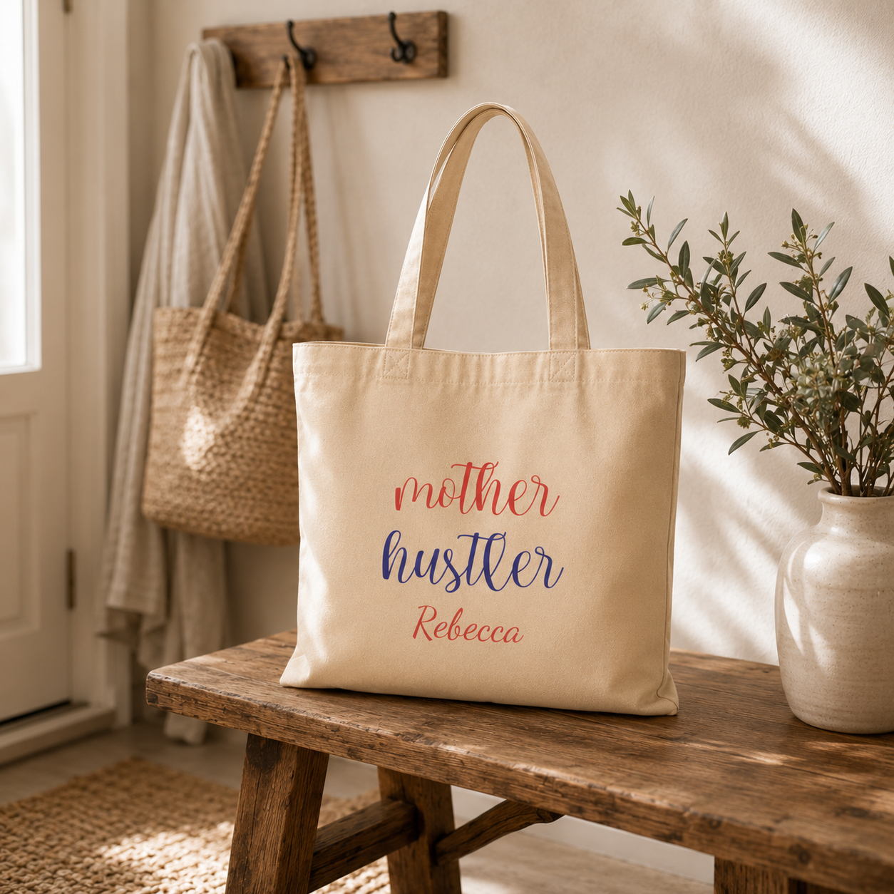 Close-up of Mother Hustler lettering and personalized name on tote